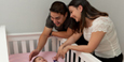 Parents Placing Baby into a Safe Sleep Environment